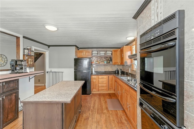 82 Martin St, East Providence, RI 02914 - kitchen featuring black appliances, light wood-style floors, a kitchen island, and open shelves