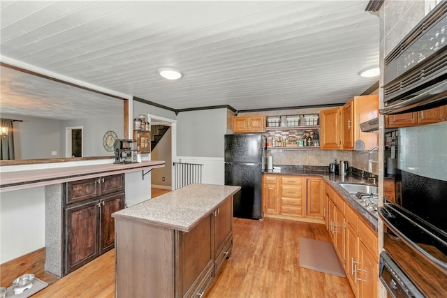 82 Martin St, East Providence, RI 02914 - kitchen with black appliances, open shelves, a kitchen island, light wood finished floors, and wooden ceiling