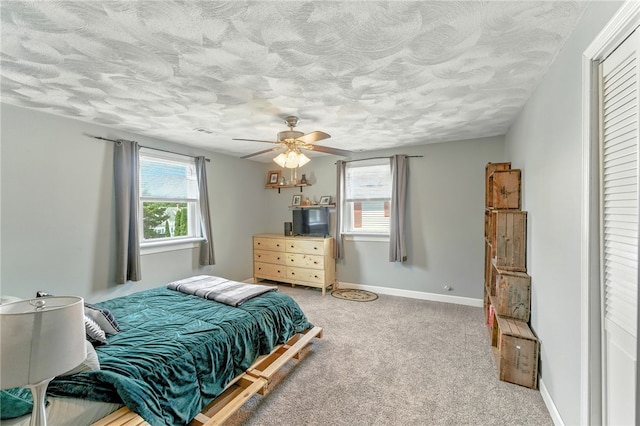 82 Martin St, East Providence, RI 02914 - bedroom featuring a textured ceiling, carpet, a ceiling fan, and a closet