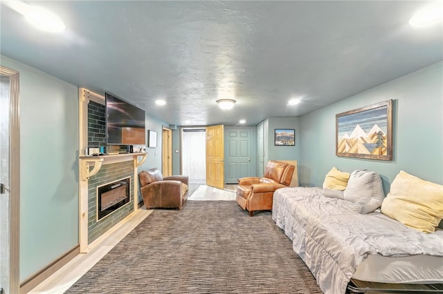 82 Martin St, East Providence, RI 02914 - bedroom with a brick fireplace, recessed lighting, and wood finished floors