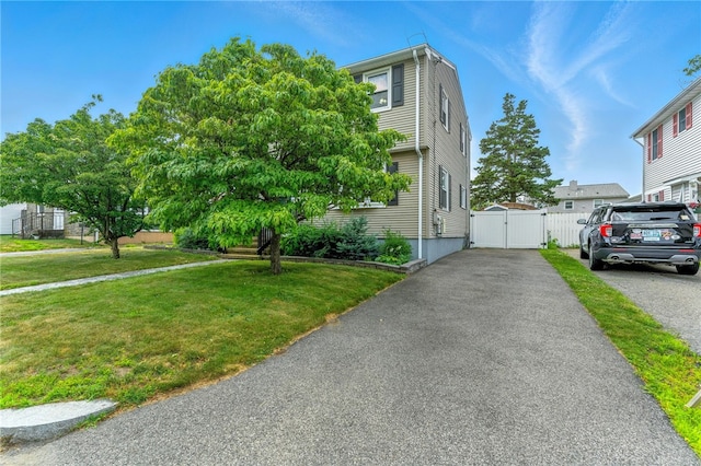 82 Martin St, East Providence, RI 02914 - view of front facade with a gate, a front yard, and driveway