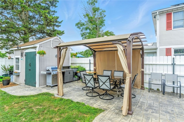 82 Martin St, East Providence, RI 02914 - view of patio with grilling area, a shed, and outdoor dining space