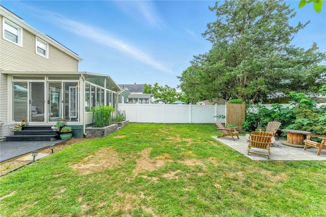 82 Martin St, East Providence, RI 02914 - view of yard featuring a sunroom, a patio, and a fire pit