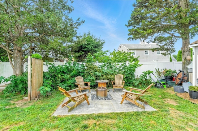 82 Martin St, East Providence, RI 02914 - fenced backyard featuring a fire pit and a patio area