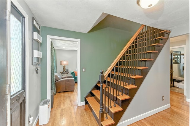 82 Martin St, East Providence, RI 02914 - staircase featuring wood finished floors and healthy amount of natural light