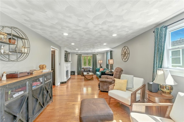 82 Martin St, East Providence, RI 02914 - living room featuring light wood-type flooring, recessed lighting, and a fireplace