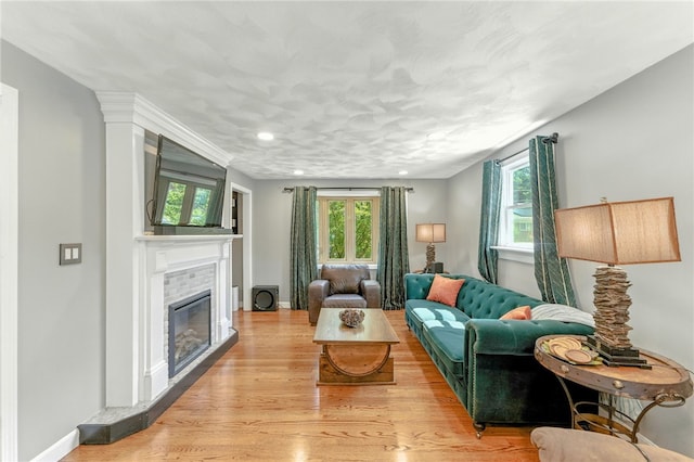 82 Martin St, East Providence, RI 02914 - living room featuring plenty of natural light, a glass covered fireplace, light wood finished floors, and recessed lighting