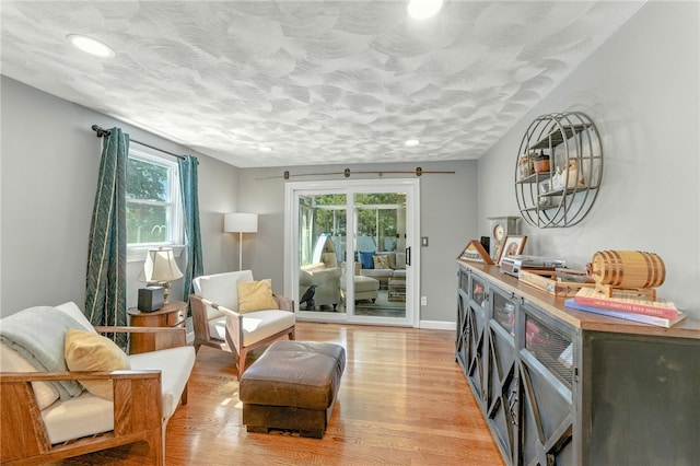 82 Martin St, East Providence, RI 02914 - sitting room with healthy amount of natural light, light wood-type flooring, recessed lighting, and a textured ceiling