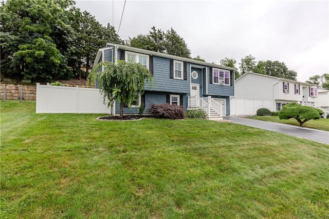 10 Pembroke Dr, Johnston, RI 02919 - bi-level home with driveway and a garage