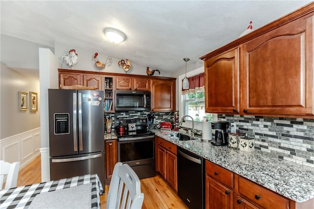 10 Pembroke Dr, Johnston, RI 02919 - kitchen featuring stainless steel appliances, light wood-style floors, tasteful backsplash, light stone counters, and lofted ceiling