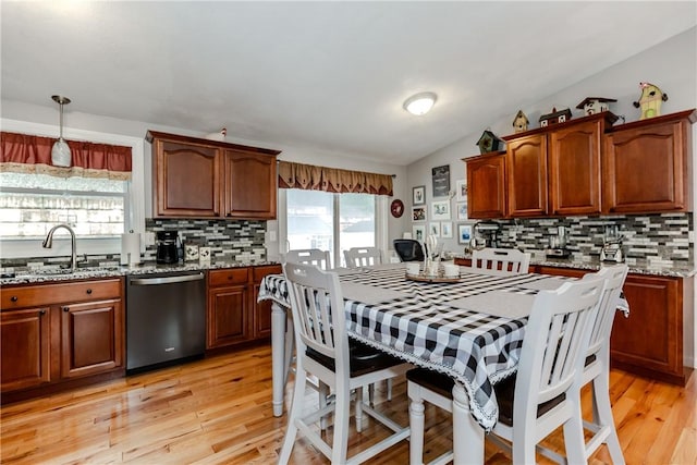 10 Pembroke Dr, Johnston, RI 02919 - kitchen with stainless steel dishwasher, light wood-style flooring, tasteful backsplash, and plenty of natural light