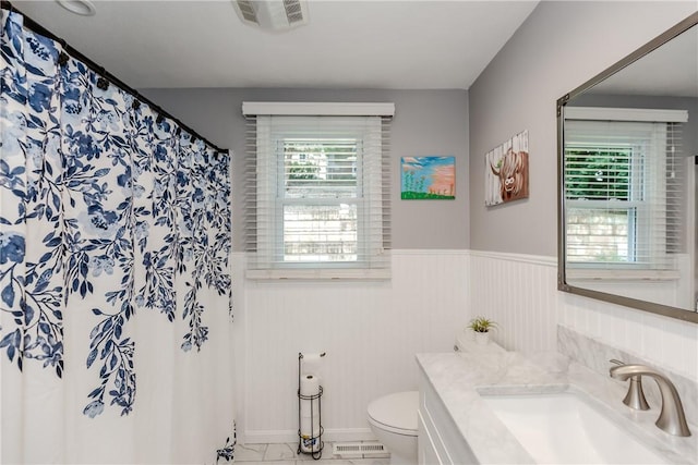 10 Pembroke Dr, Johnston, RI 02919 - bathroom with vanity, wainscoting, and a shower with curtain