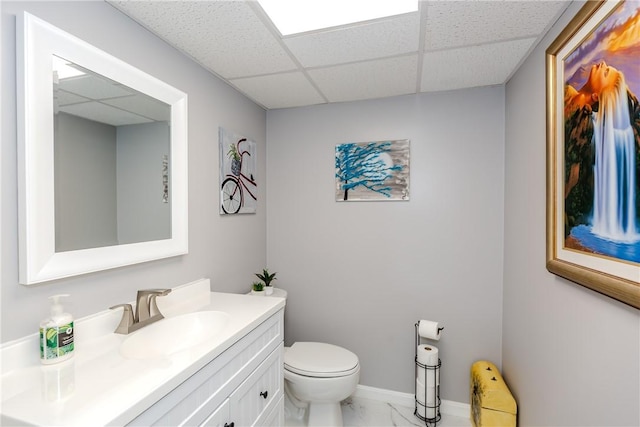 10 Pembroke Dr, Johnston, RI 02919 - bathroom with a drop ceiling, vanity, and marble look tiles