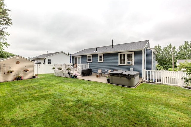 10 Pembroke Dr, Johnston, RI 02919 - rear view of house with a fenced backyard, a patio, and a storage unit