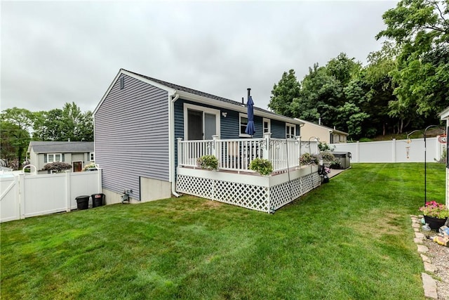 10 Pembroke Dr, Johnston, RI 02919 - rear view of property with a fenced backyard and a deck