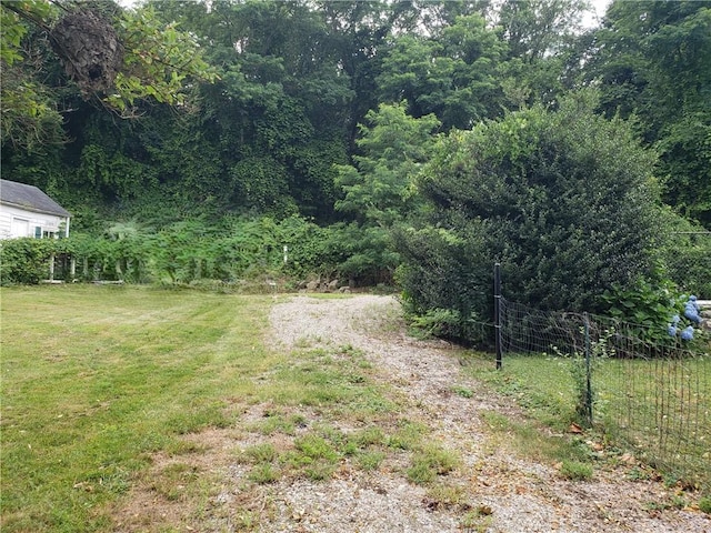 603 Wakefield St, West Warwick, RI 02893 - view of yard with a wooded view
