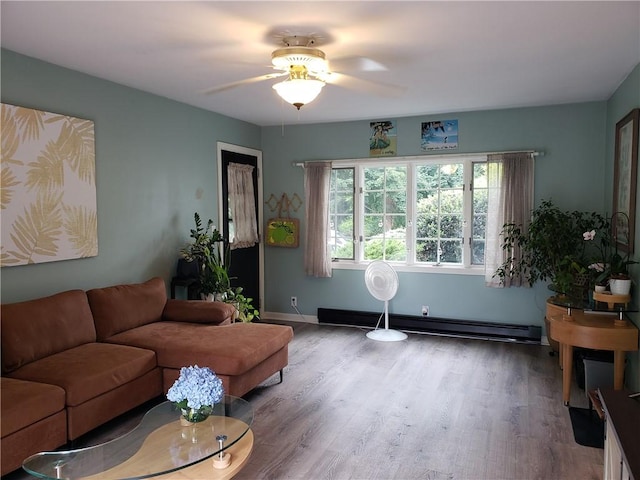 603 Wakefield St, West Warwick, RI 02893 - living area featuring a baseboard radiator, ceiling fan, and wood finished floors