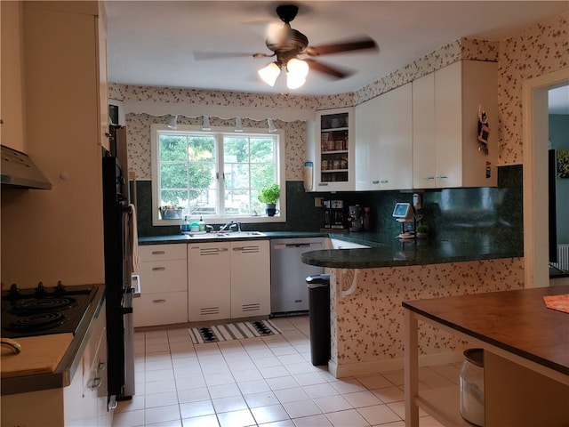 603 Wakefield St, West Warwick, RI 02893 - kitchen with stainless steel dishwasher, black electric cooktop, a peninsula, a ceiling fan, and dark countertops