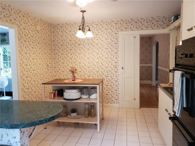 603 Wakefield St, West Warwick, RI 02893 - dining area with arched walkways and light tile patterned floors