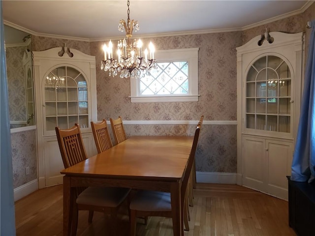 603 Wakefield St, West Warwick, RI 02893 - dining area featuring wood-type flooring, a chandelier, and wallpapered walls