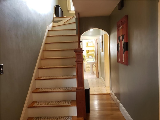 603 Wakefield St, West Warwick, RI 02893 - stairs with arched walkways and wood finished floors