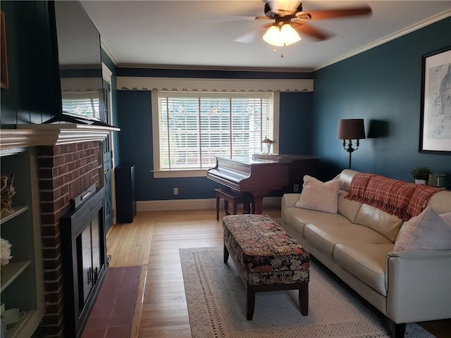 603 Wakefield St, West Warwick, RI 02893 - living area with a fireplace, ornamental molding, ceiling fan, and wood finished floors