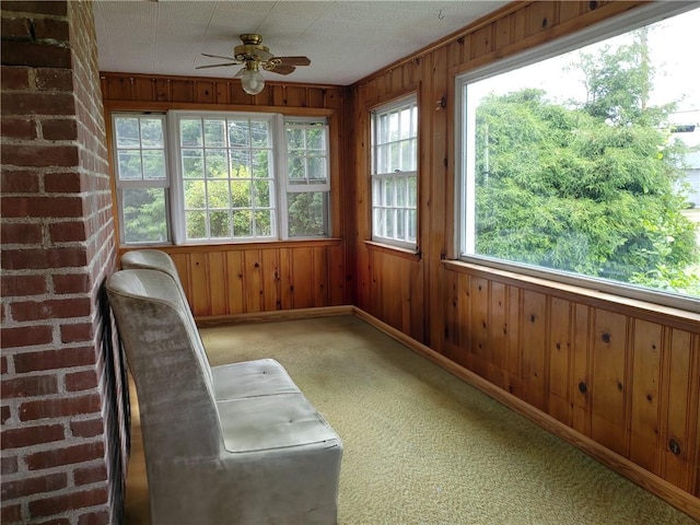 603 Wakefield St, West Warwick, RI 02893 - sunroom featuring wood walls and carpet