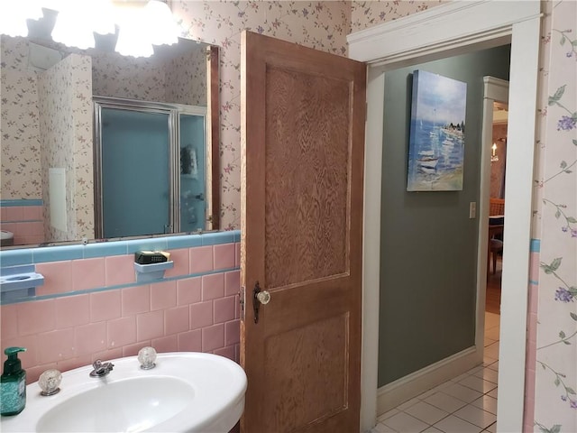 603 Wakefield St, West Warwick, RI 02893 - bathroom featuring wallpapered walls, tile patterned flooring, and a shower stall