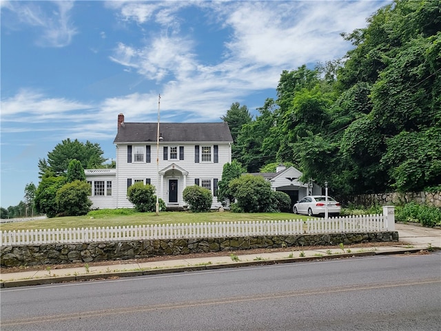 603 Wakefield St, West Warwick, RI 02893 - colonial-style house featuring a chimney and a fenced front yard