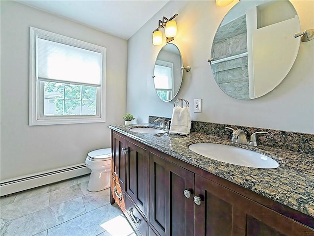15 Lilac Cir, Cranston, RI 02920 - full bath with baseboard heating, double vanity, and healthy amount of natural light