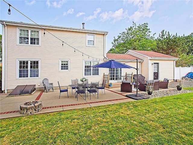 15 Lilac Cir, Cranston, RI 02920 - rear view of property featuring an outdoor living space with a fire pit, a patio, and a yard