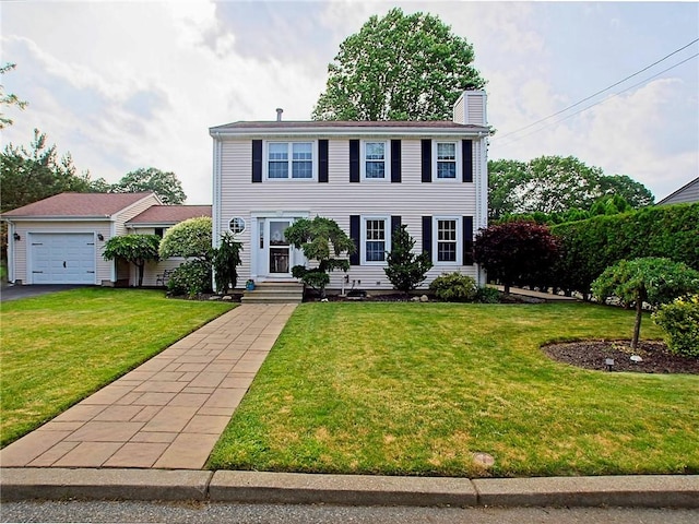 15 Lilac Cir, Cranston, RI 02920 - colonial home with a chimney, a front lawn, asphalt driveway, and a garage
