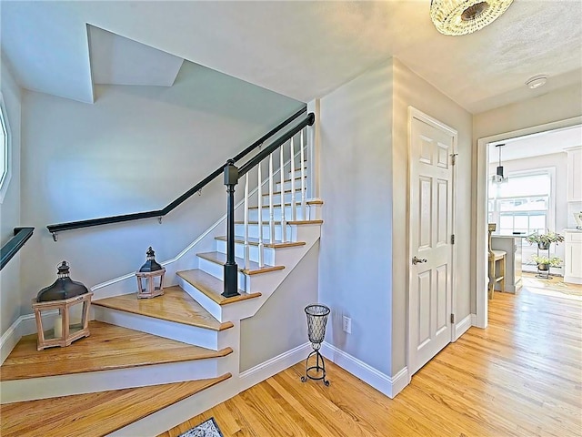 15 Lilac Cir, Cranston, RI 02920 - staircase featuring wood finished floors and baseboards