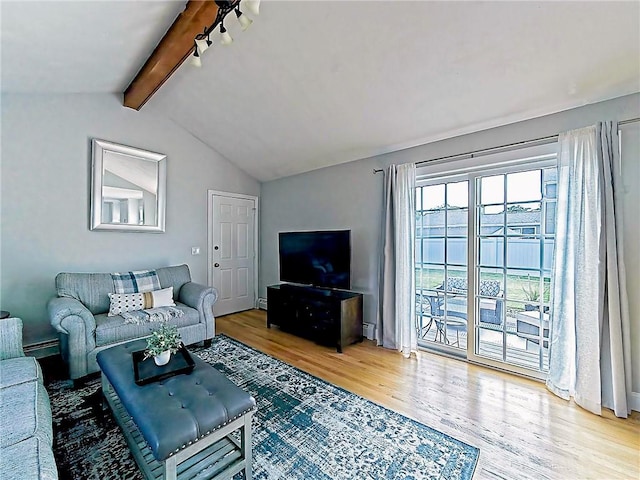 15 Lilac Cir, Cranston, RI 02920 - living area featuring wood finished floors, a baseboard heating unit, and track lighting