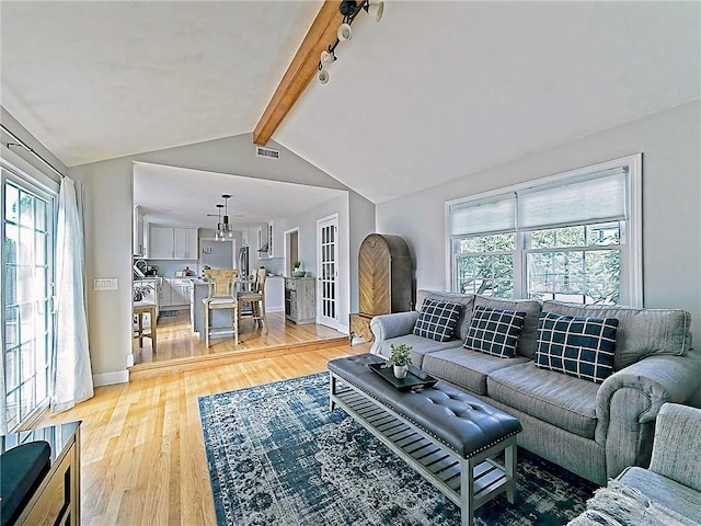 15 Lilac Cir, Cranston, RI 02920 - living area with light wood-style floors and plenty of natural light