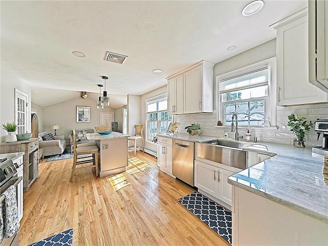 15 Lilac Cir, Cranston, RI 02920 - kitchen with dishwasher, light wood-type flooring, range, open floor plan, and white cabinets