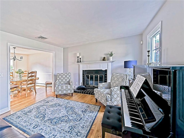 15 Lilac Cir, Cranston, RI 02920 - living room with a glass covered fireplace and wood finished floors