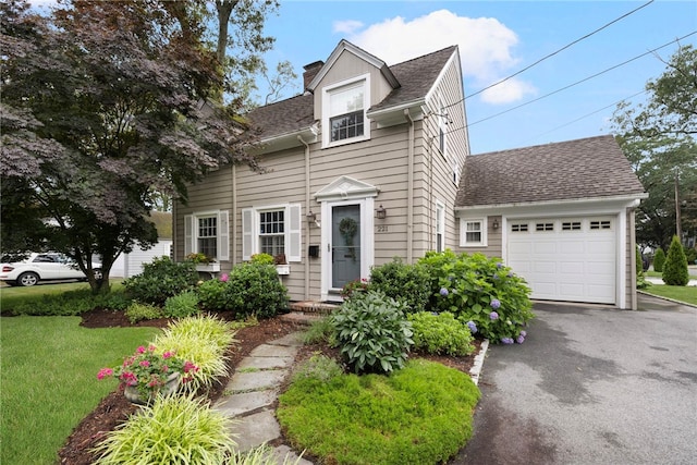 221 Trinity St, Warwick, RI 02886 - view of front of home featuring a shingled roof, a garage, a chimney, and asphalt driveway