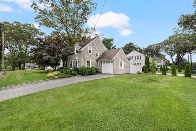 221 Trinity St, Warwick, RI 02886 - view of front facade featuring an attached garage, driveway, a front lawn, and a chimney