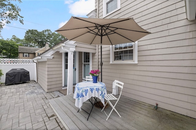 221 Trinity St, Warwick, RI 02886 - wooden terrace with outdoor dining area, a grill, and a patio area