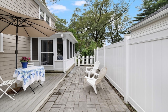 221 Trinity St, Warwick, RI 02886 - wooden terrace featuring a sunroom and a patio area
