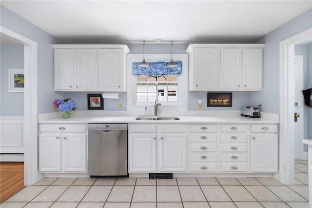 221 Trinity St, Warwick, RI 02886 - kitchen with dishwasher, white cabinetry, a baseboard heating unit, and light countertops