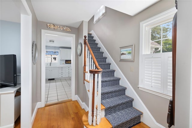 221 Trinity St, Warwick, RI 02886 - stairway with wood finished floors and baseboards