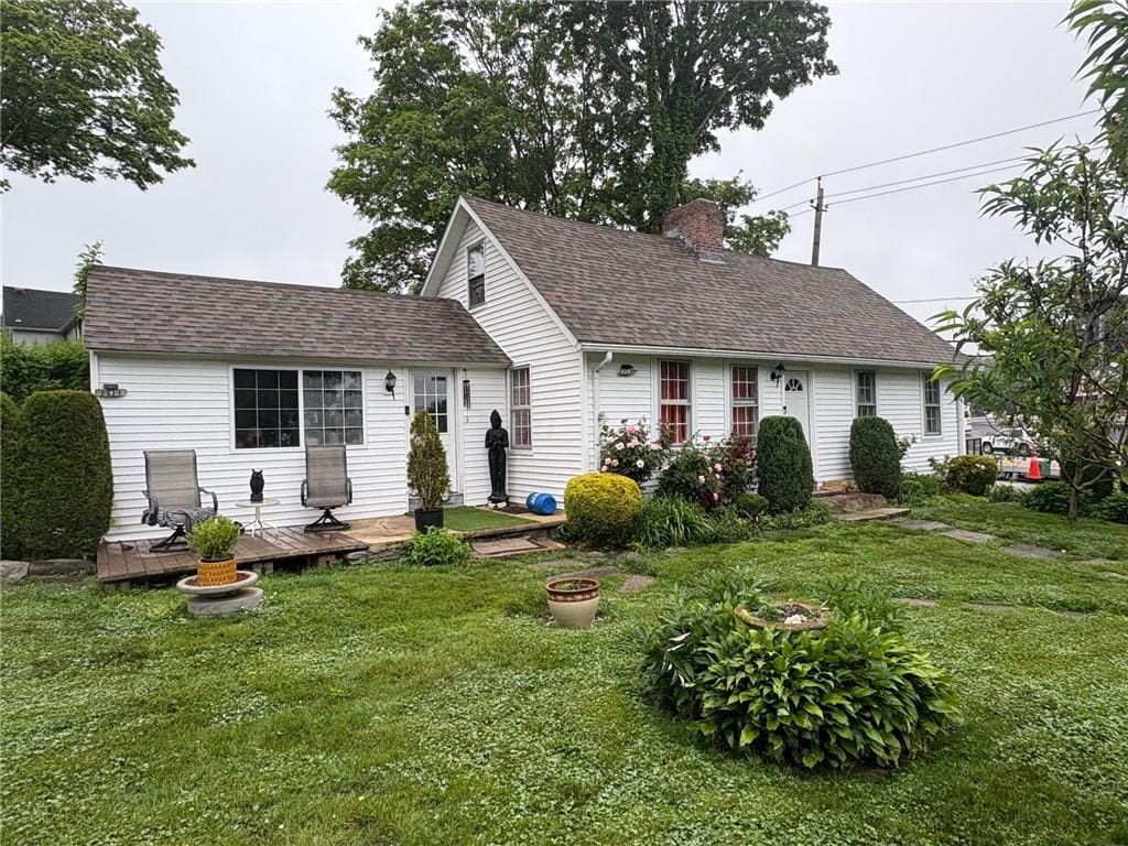 264 W Main St, North Kingstown, RI 02852 - cape cod-style house with a chimney, a front lawn, a deck, and a shingled roof