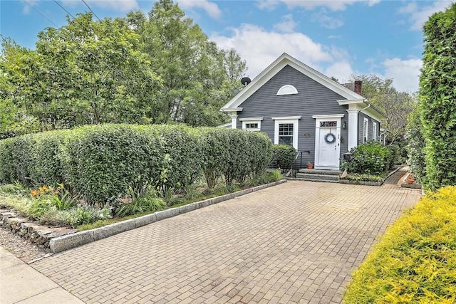 53 Avon St, Somerset, MA 02726 - view of front of house with a chimney