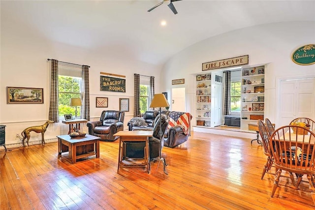 53 Avon St, Somerset, MA 02726 - living area featuring vaulted ceiling, light wood-type flooring, plenty of natural light, and a ceiling fan