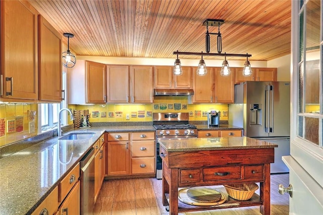 53 Avon St, Somerset, MA 02726 - kitchen featuring appliances with stainless steel finishes, under cabinet range hood, wood ceiling, decorative light fixtures, and dark stone counters