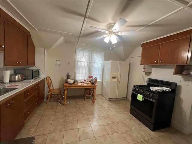 12 Winthrop St, Cranston, RI 02910 - kitchen with gas stove, white refrigerator with ice dispenser, stainless steel microwave, ceiling fan, and lofted ceiling