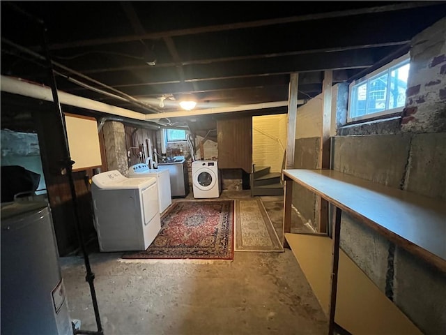 12 Winthrop St, Cranston, RI 02910 - below grade area featuring washer and clothes dryer, water heater, and stairs
