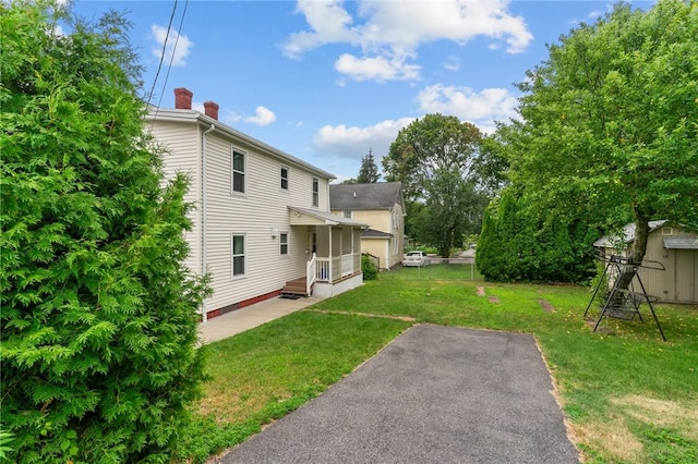10 Foundry St, Central Falls, RI 02863 - view of green lawn with a patio area